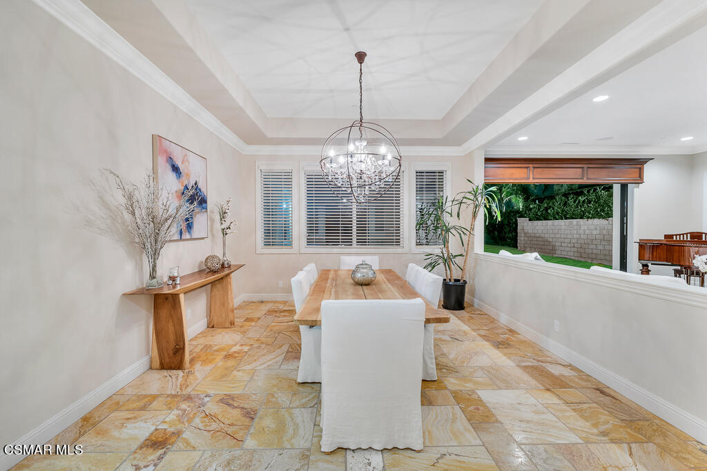 7379 Nicklaus Road Moorpark, CA 93021 - Photo 10 of 85 a living room with furniture and a chandelier