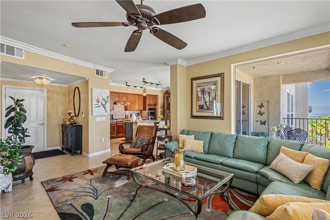 2555 Hampton Road, Unit 3308 Henderson, NV 89052 - Photo 11 of 65 A living space merges with the kitchen and an outdoor balcony, creating an inviting flow for entertaining.