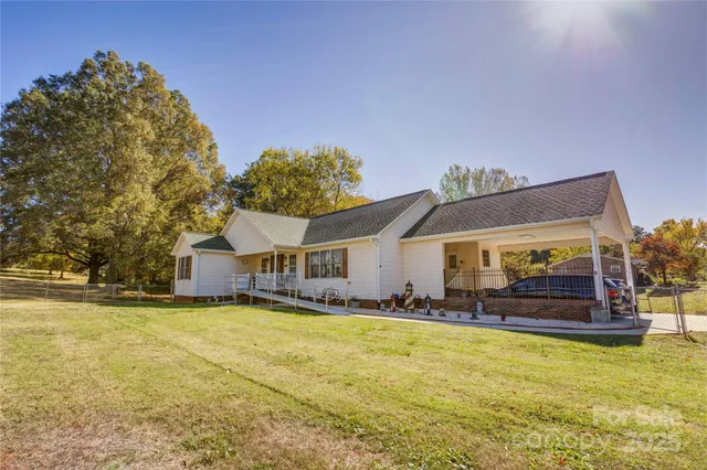 a house view with swimming pool in front of it