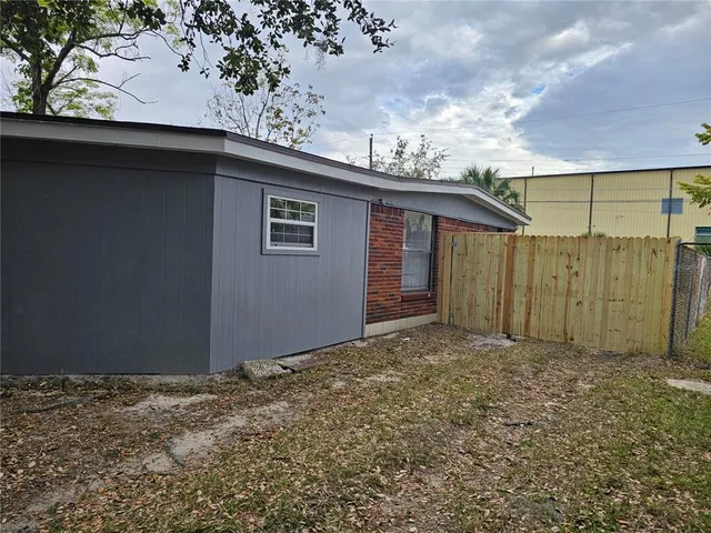 a backyard of a house with lots of green space
