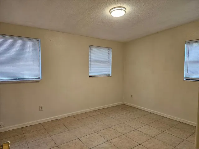 an empty room with a empty space and window