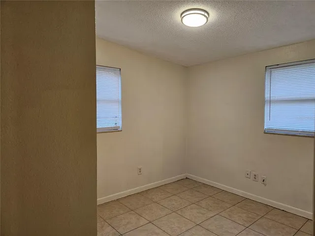 a kitchen with a refrigerator and cabinets