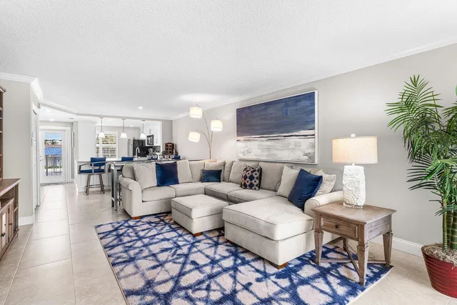 a living room with furniture and a lamp