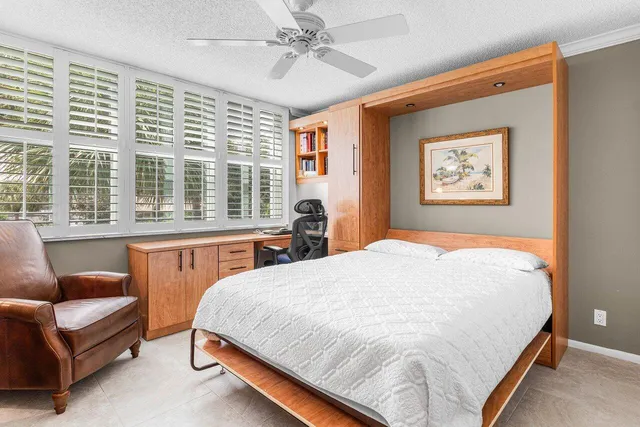 a bedroom with a large bed and a couch