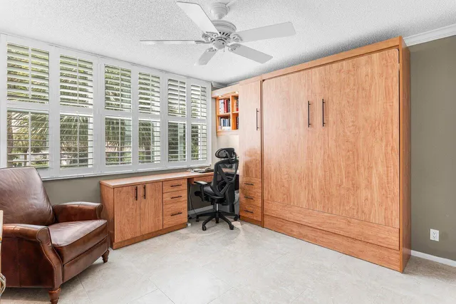 a view of workspace with furniture and a window