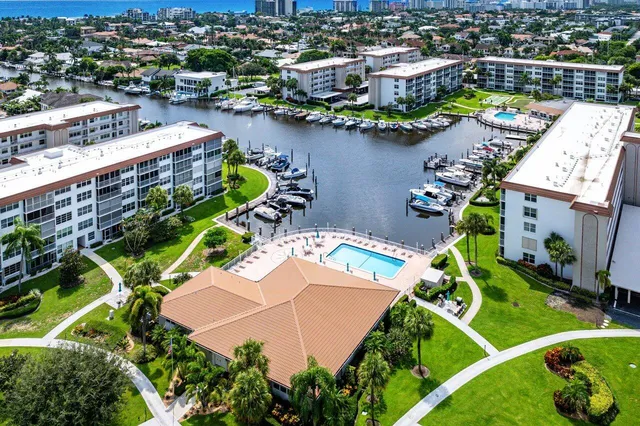 an aerial view of a house with a lake view