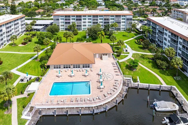 a view of a chairs and table in the backyard