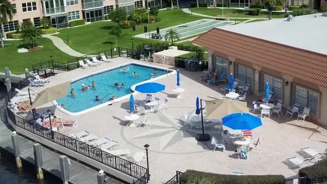 a view of a chairs and table in backyard
