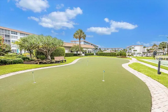 a view of a swimming pool is middle in the middle of a building