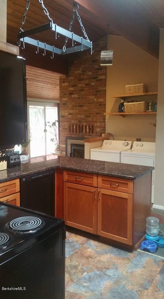 1785 East Windsor Road Windsor, MA 01270 - Photo 13 of 24 a kitchen with stainless steel appliances granite countertop a sink stove and cabinets
