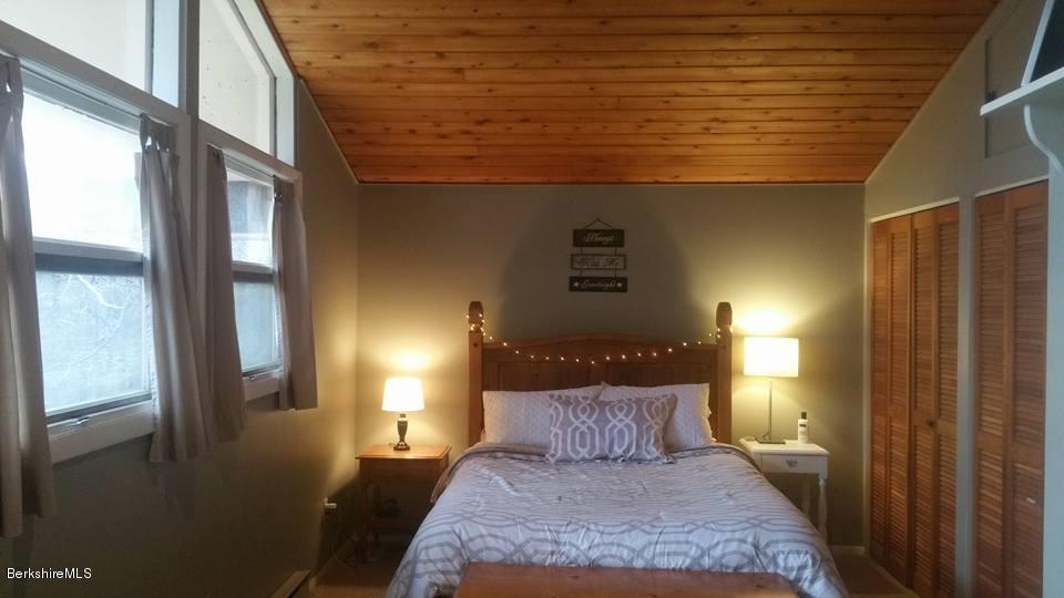 1785 East Windsor Road Windsor, MA 01270 - Photo 18 of 24 a bed sitting in a bedroom next to a window