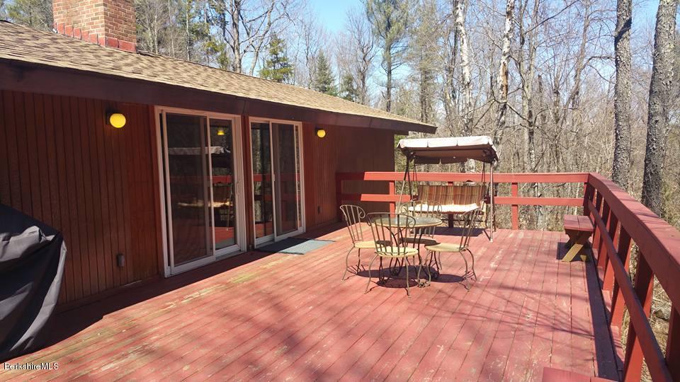 1785 East Windsor Road Windsor, MA 01270 - Photo 6 of 24 a view of a patio with table and chairs and wooden floor