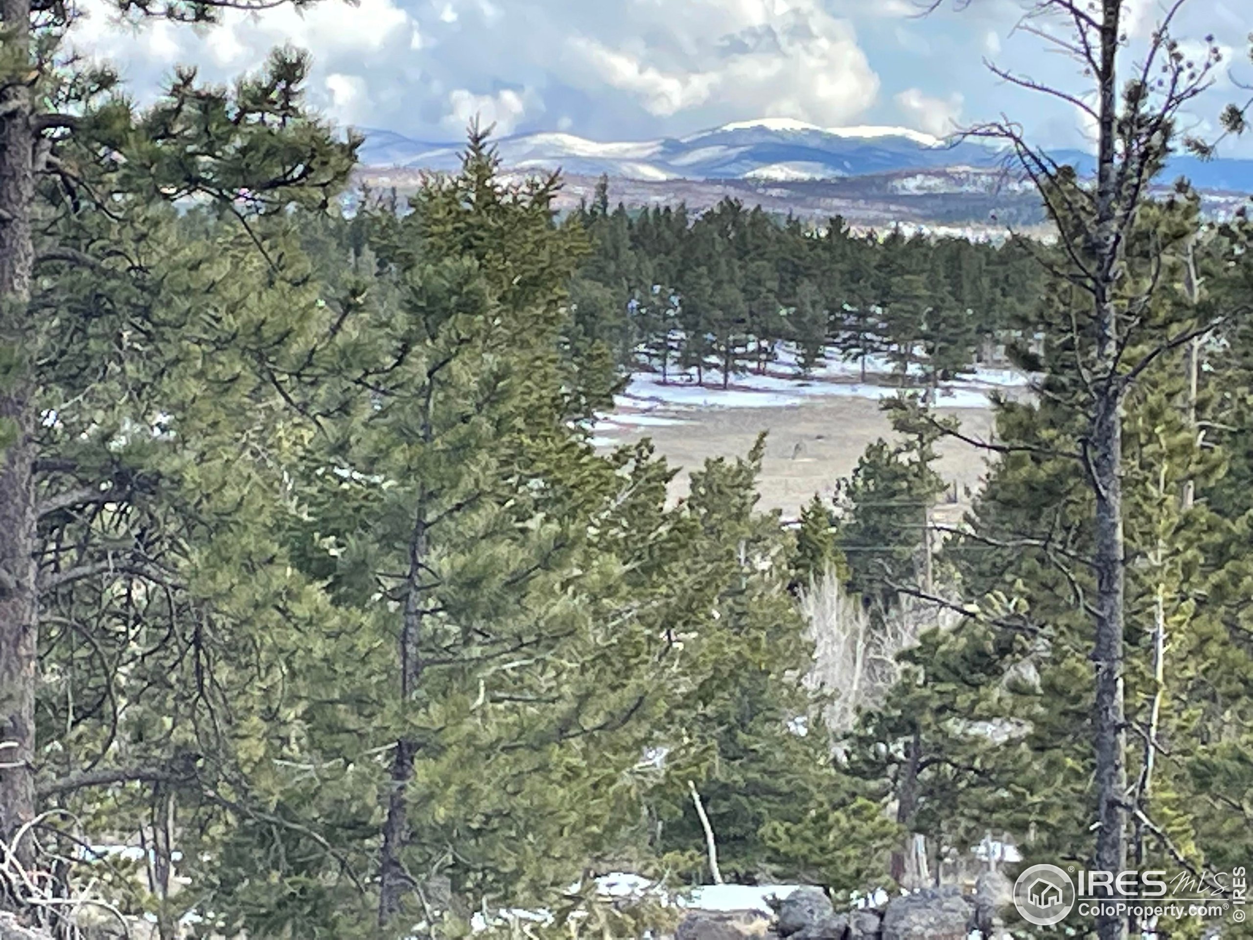 a view of a town with mountains in the background