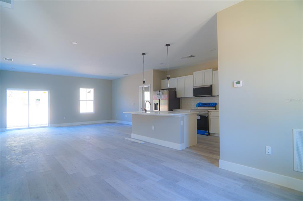 8413 Southwest 131st Lane Ocala, FL 34473 - Photo 2 of 28 a view of a kitchen with cabinets stainless steel appliances and a window