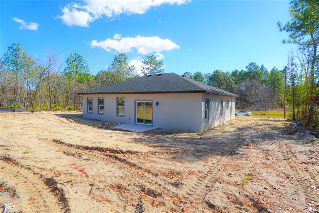 8413 Southwest 131st Lane Ocala, FL 34473 - Photo 24 of 28 a house view with a backyard space