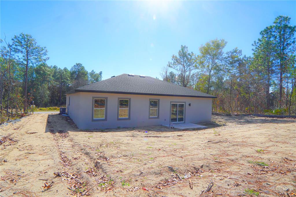 8413 Southwest 131st Lane Ocala, FL 34473 - Photo 25 of 28 a house that has a tree in front of it