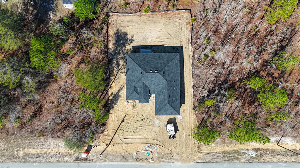 8413 Southwest 131st Lane Ocala, FL 34473 - Photo 26 of 28 front view of a house with a tree
