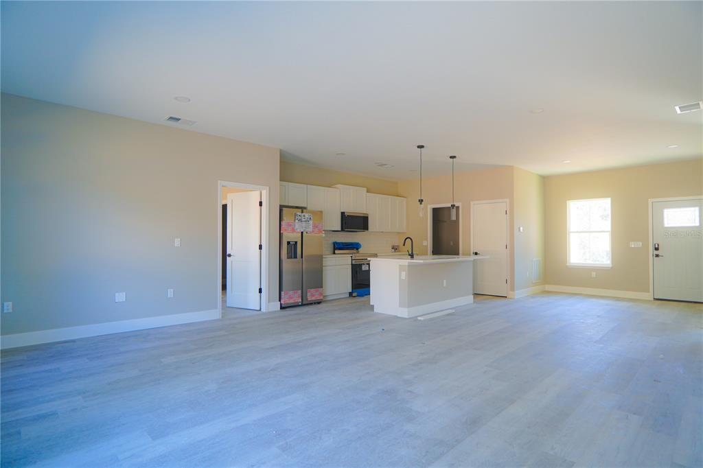 8413 Southwest 131st Lane Ocala, FL 34473 - Photo 6 of 28 a view of a kitchen with furniture and a window