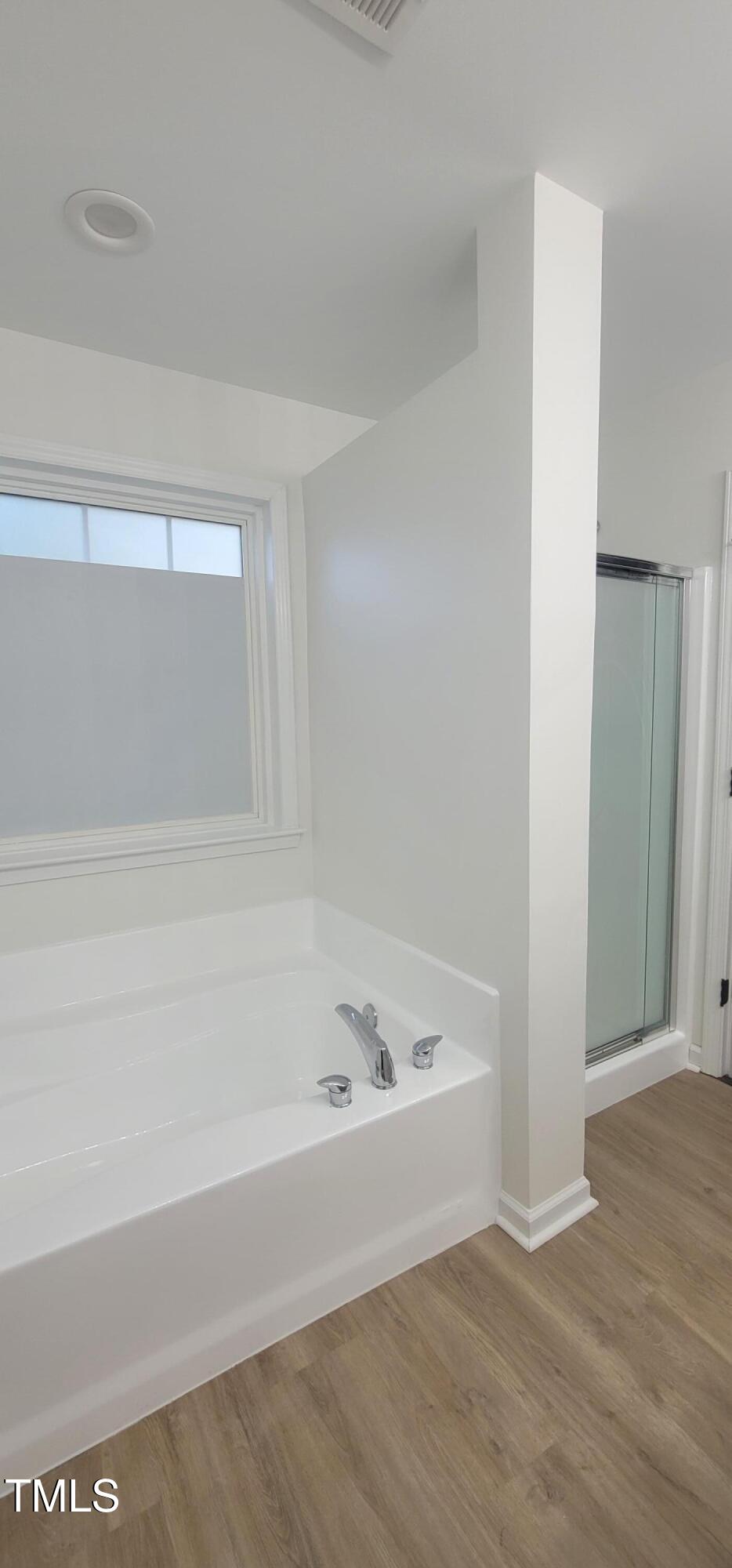 3244 Marcony Way Raleigh, NC 27610 - Photo 19 of 30 Primary Bedroom Spa Oasis w/ separate tub and shower.
