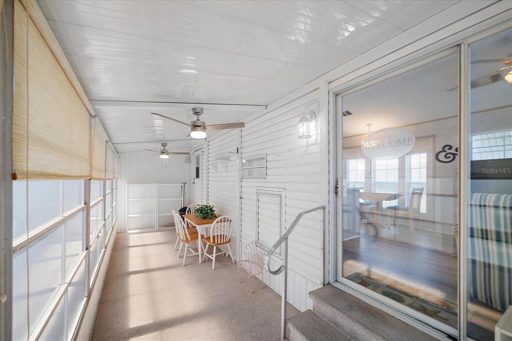 14 Basin Street Palmetto, FL 34221 - Photo 23 of 27 a bathroom with a glass shower door and a glass door shower