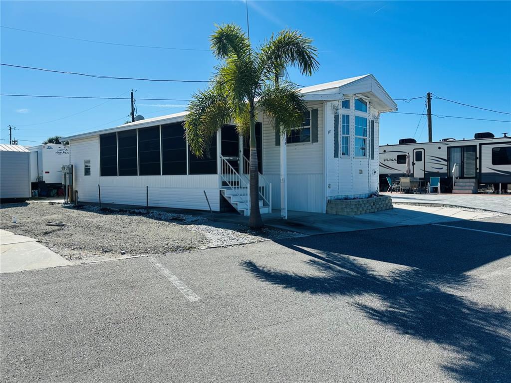 14 Basin Street Palmetto, FL 34221 - Photo 5 of 27 a front view of a house with a yard and garage