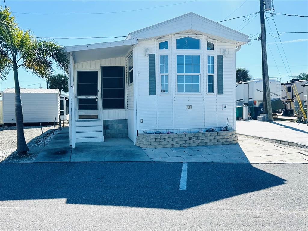 14 Basin Street Palmetto, FL 34221 - Photo 6 of 27 a front view of a house with garage