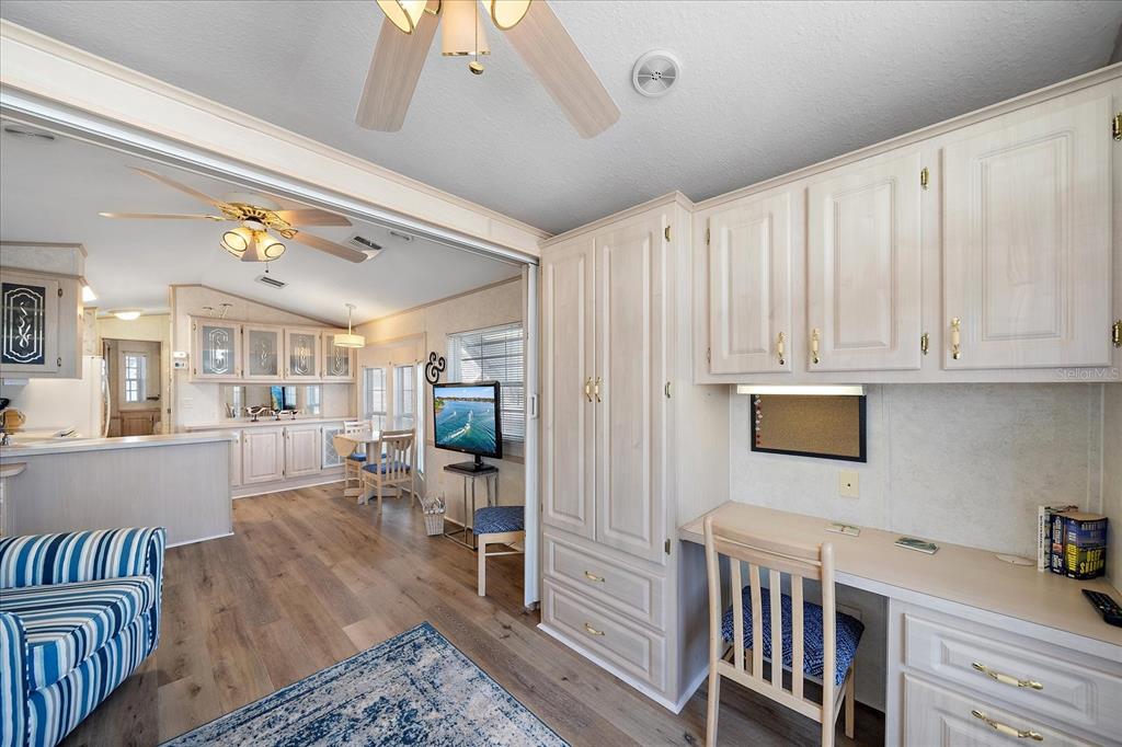 14 Basin Street Palmetto, FL 34221 - Photo 9 of 27 a living room with furniture and a wooden floor