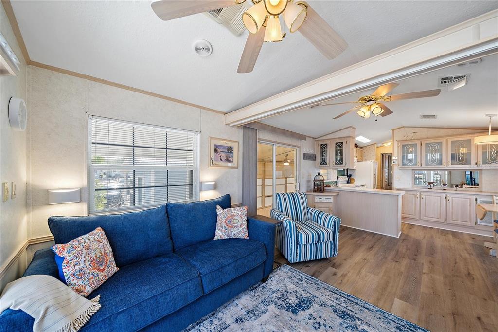 14 Basin Street Palmetto, FL 34221 - Photo 10 of 27 a living room with furniture and wooden floor