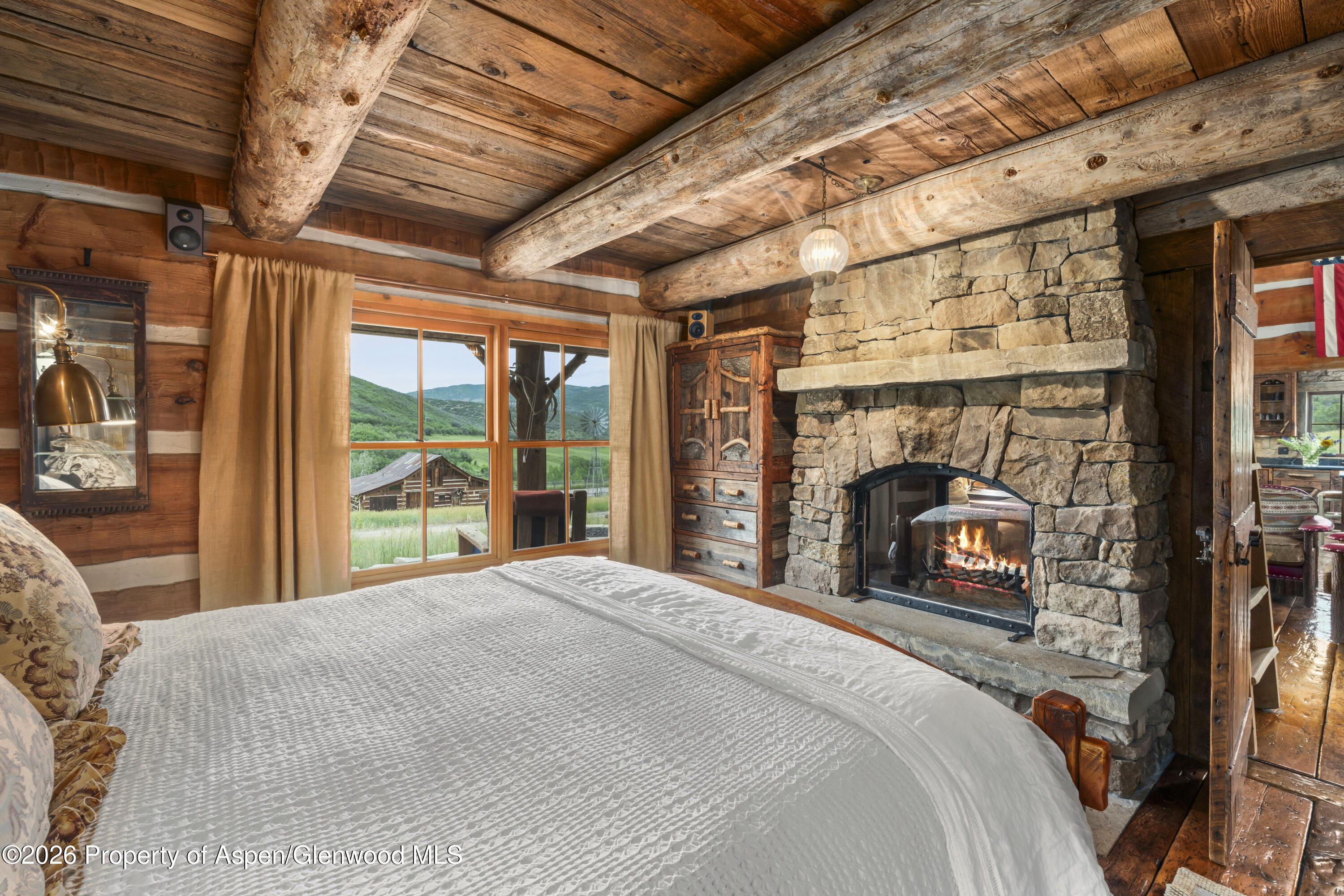1350 Old Herron Road Basalt, CO 81621 - Photo 23 of 81 a bedroom with a bed and a fireplace