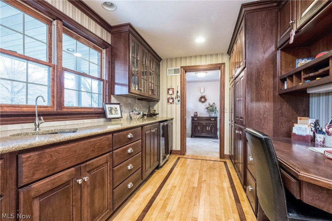 2815 Westdale Road Northwest Canton, OH 44708 - Photo 10 of 33 Butlers pantry with wood floors, storage, & home work station.