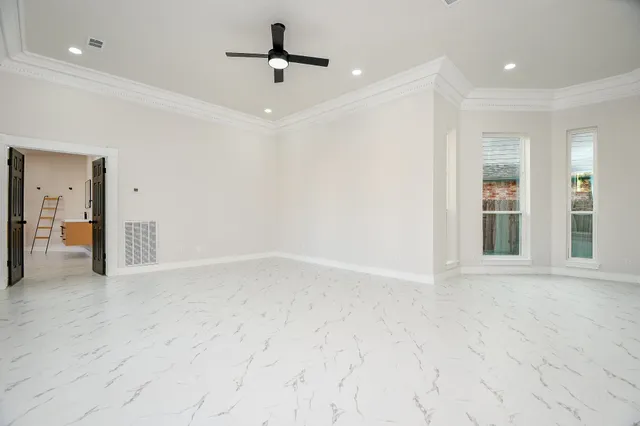 a view of an empty room with a window