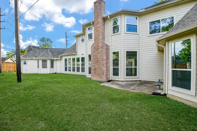 a view of a backyard with a garden and plants