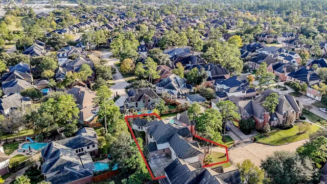 an aerial view of a houses with outdoor space