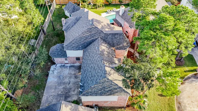 an aerial view of a house with a garden
