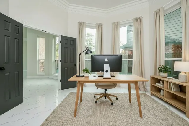 a workspace with furniture and a window