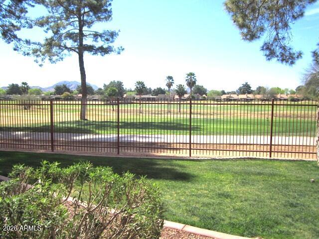 4303 East Cactus Road, Unit 130 Phoenix, AZ 85032 - Photo 1 of 17 10 130 GOLF COURSE WITH MOUNTAINS BEYOND