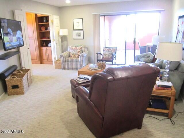4303 East Cactus Road, Unit 130 Phoenix, AZ 85032 - Photo 9 of 17 10 130 LIVING ROOM OPENS TO PATIO AND BE