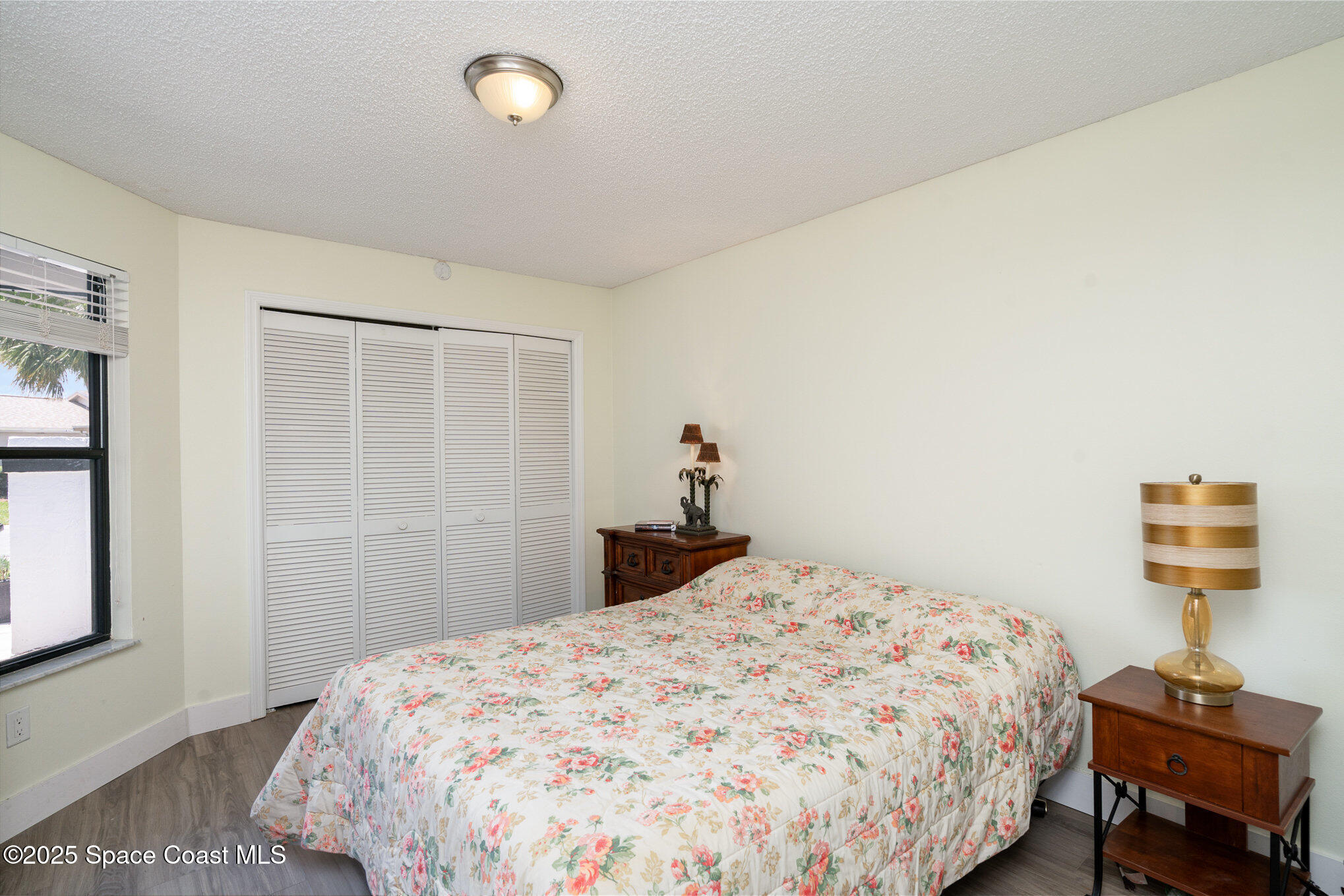 313 Pine Ridge Lane Melbourne, FL 32940 - Photo 14 of 28 a bedroom with a bed and a window