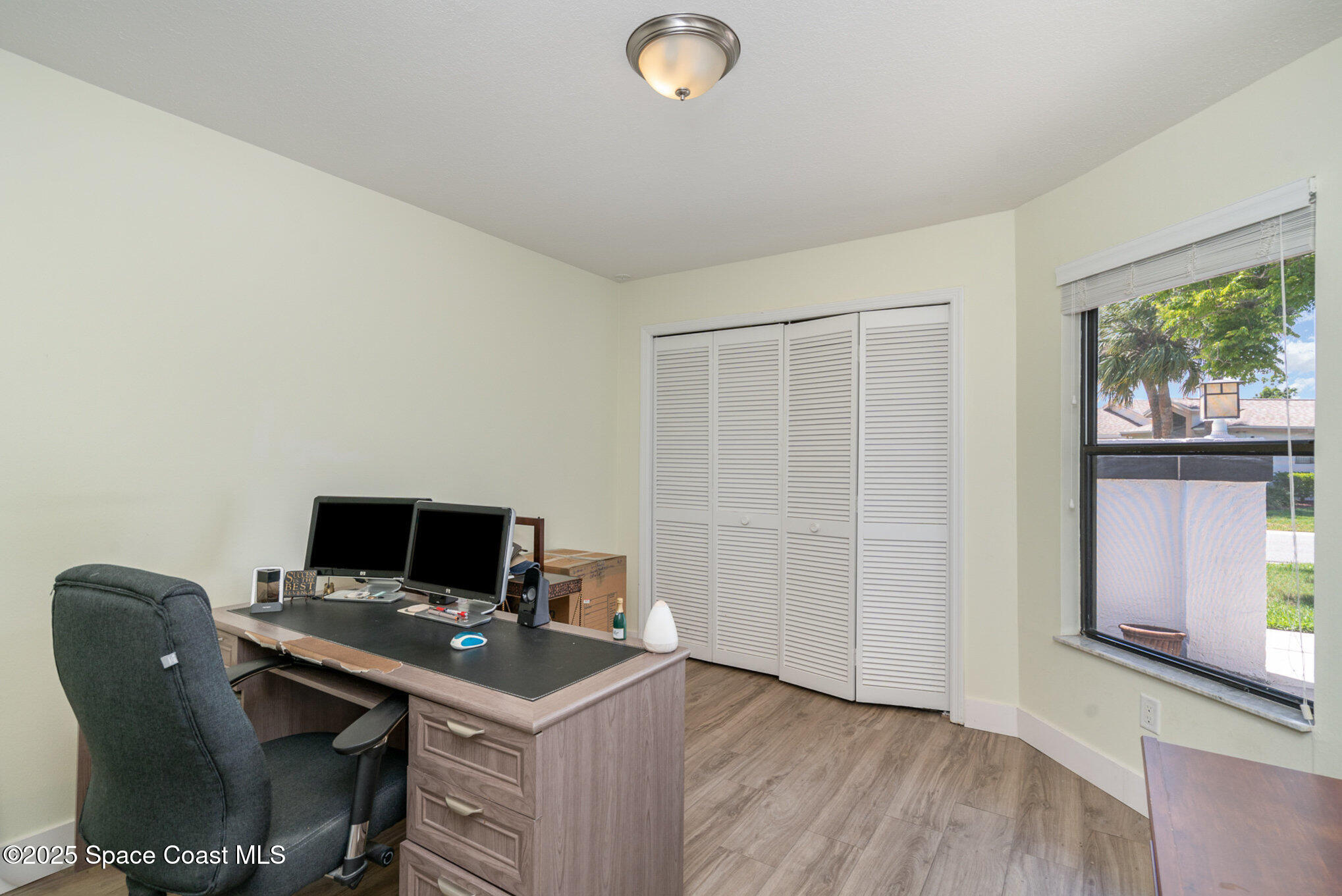 313 Pine Ridge Lane Melbourne, FL 32940 - Photo 16 of 28 a view of workspace with furniture and window