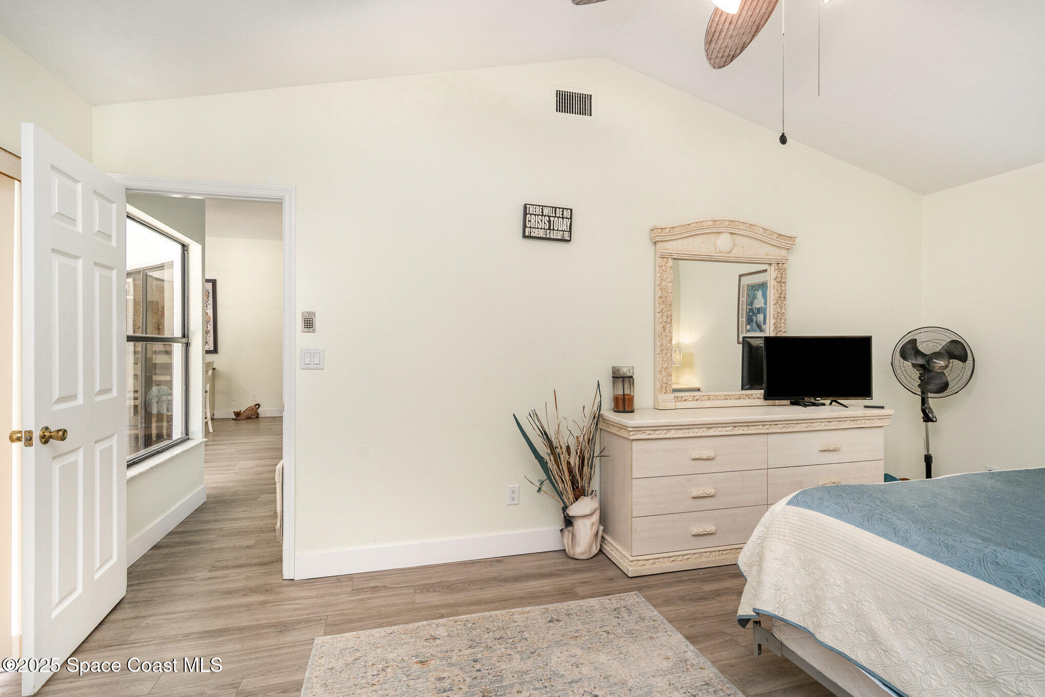 313 Pine Ridge Lane Melbourne, FL 32940 - Photo 19 of 28 a bedroom with a bed and a television