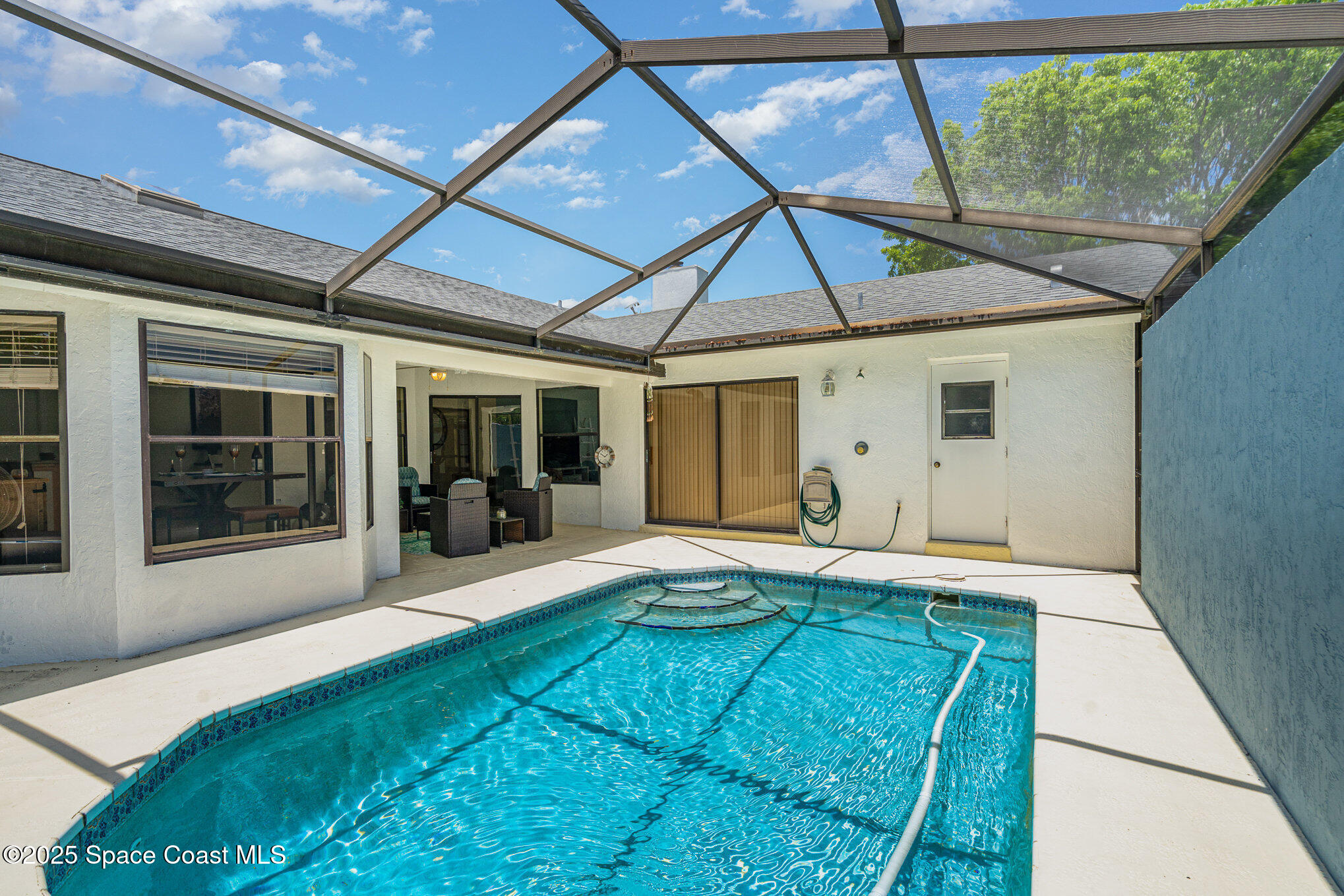 313 Pine Ridge Lane Melbourne, FL 32940 - Photo 23 of 28 a front view of a house with a yard and porch