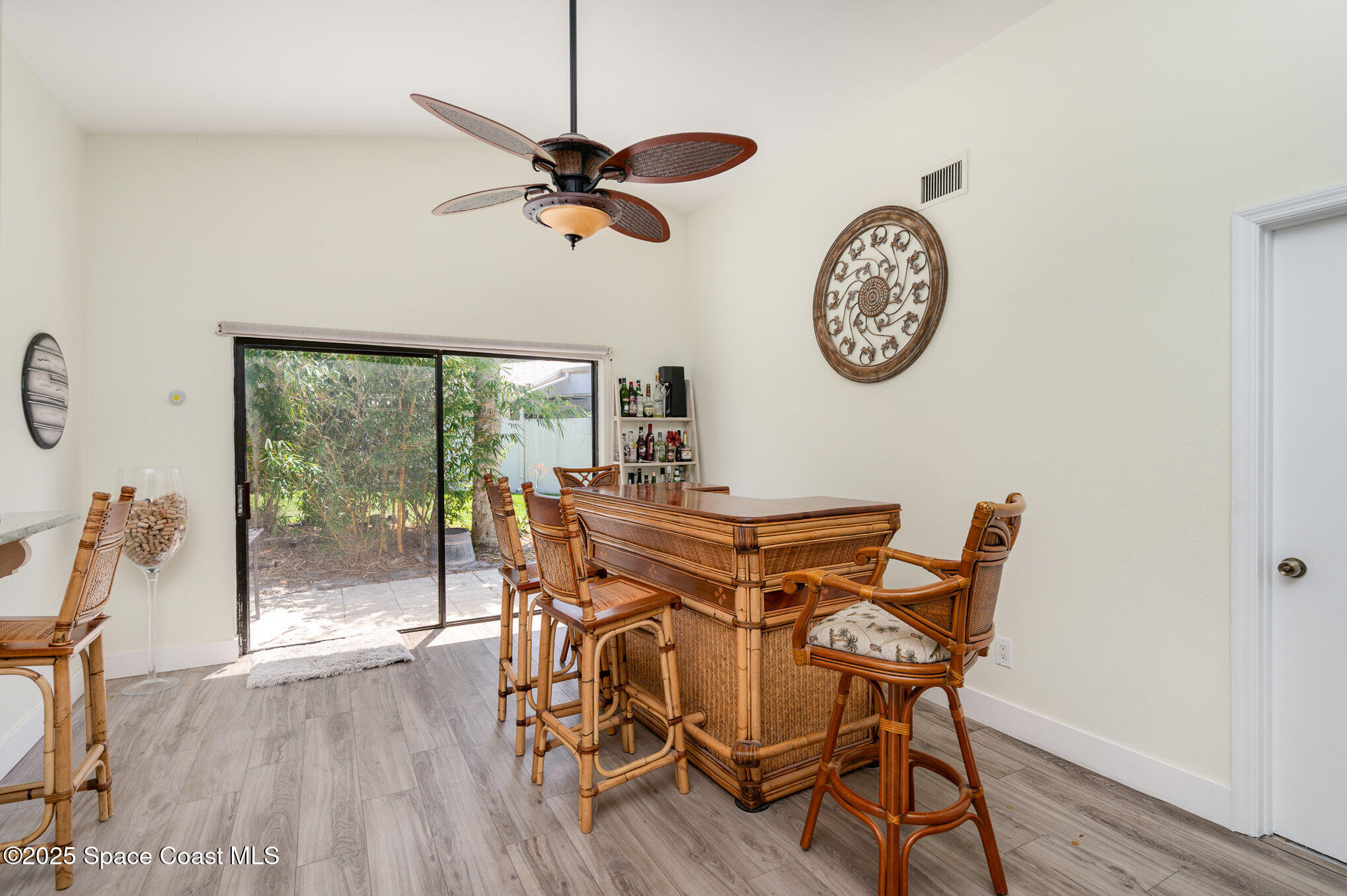 313 Pine Ridge Lane Melbourne, FL 32940 - Photo 10 of 28 a view of a dining room with furniture window and wooden floor