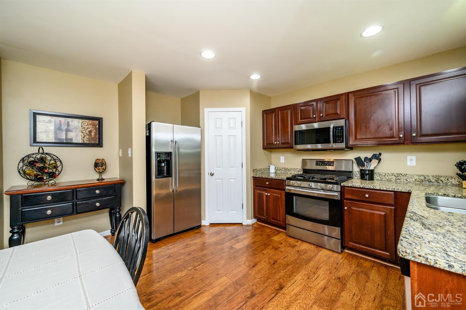 65 Lamp Post Drive Barnegat, NJ 08005 - Photo 11 of 36 a kitchen with stainless steel appliances granite countertop a refrigerator stove and sink