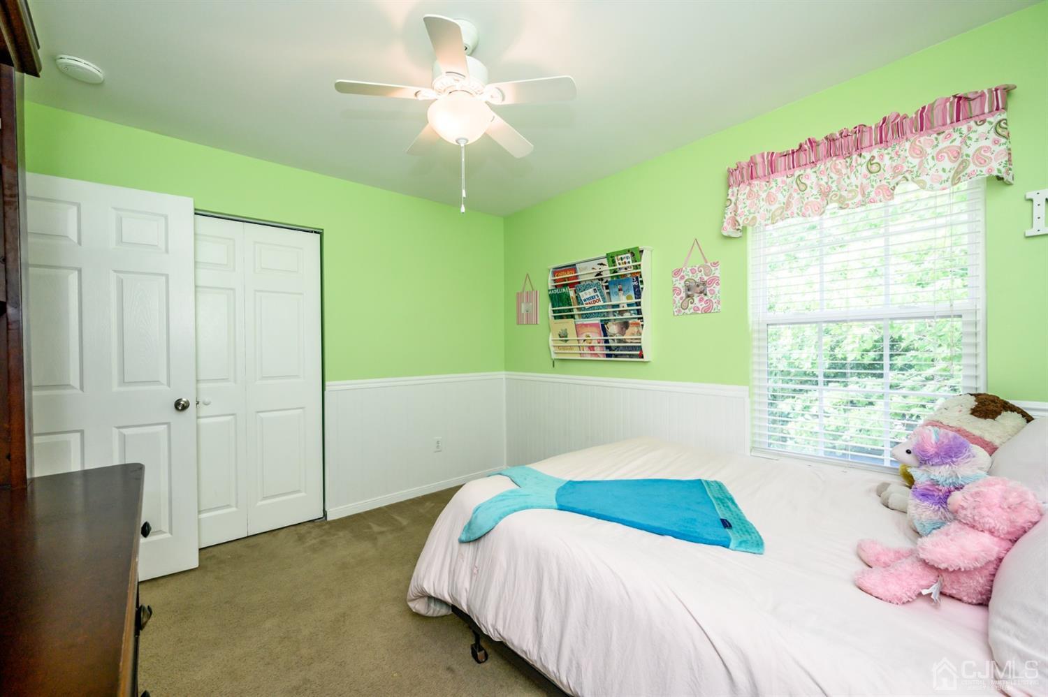 65 Lamp Post Drive Barnegat, NJ 08005 - Photo 17 of 36 a bedroom with a bed and a chandelier