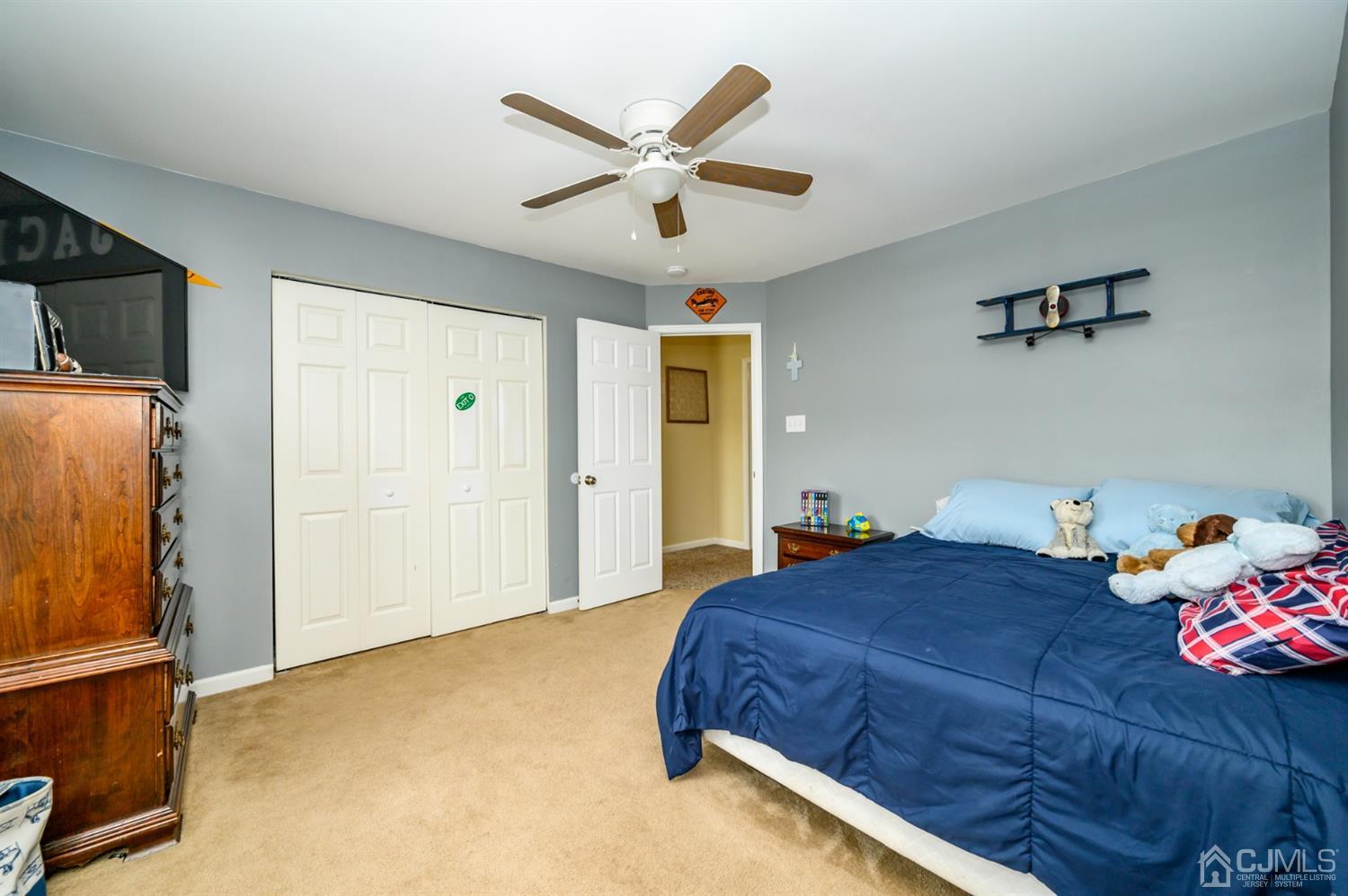 65 Lamp Post Drive Barnegat, NJ 08005 - Photo 20 of 36 a bedroom with a bed and a ceiling fan