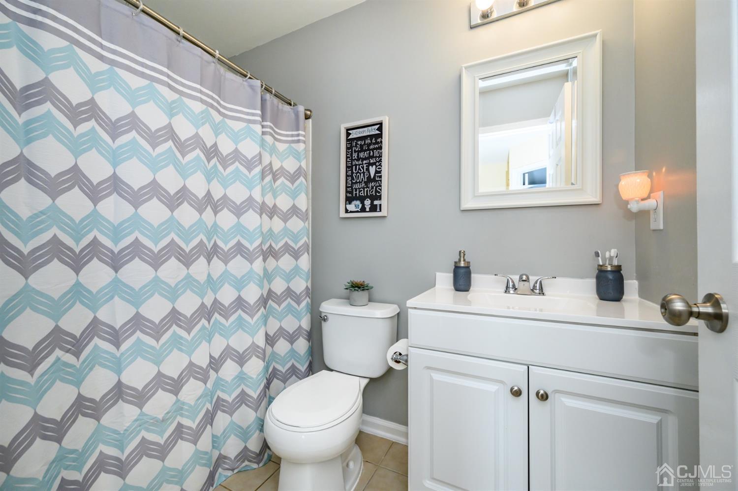 65 Lamp Post Drive Barnegat, NJ 08005 - Photo 21 of 36 a bathroom with a sink toilet and a mirror