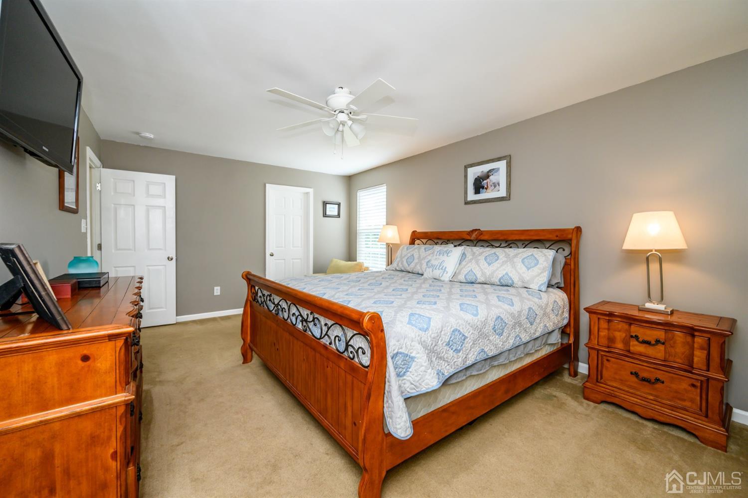 65 Lamp Post Drive Barnegat, NJ 08005 - Photo 23 of 36 a bed room with a bed and a tv