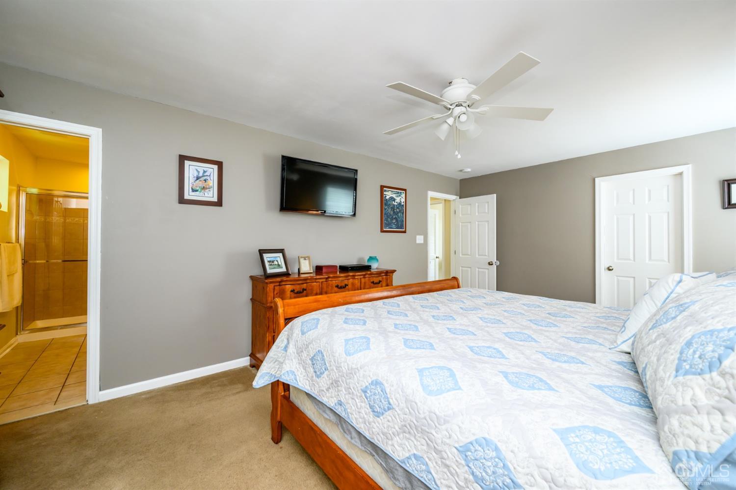 65 Lamp Post Drive Barnegat, NJ 08005 - Photo 24 of 36 a bedroom with a bed and a flat screen tv