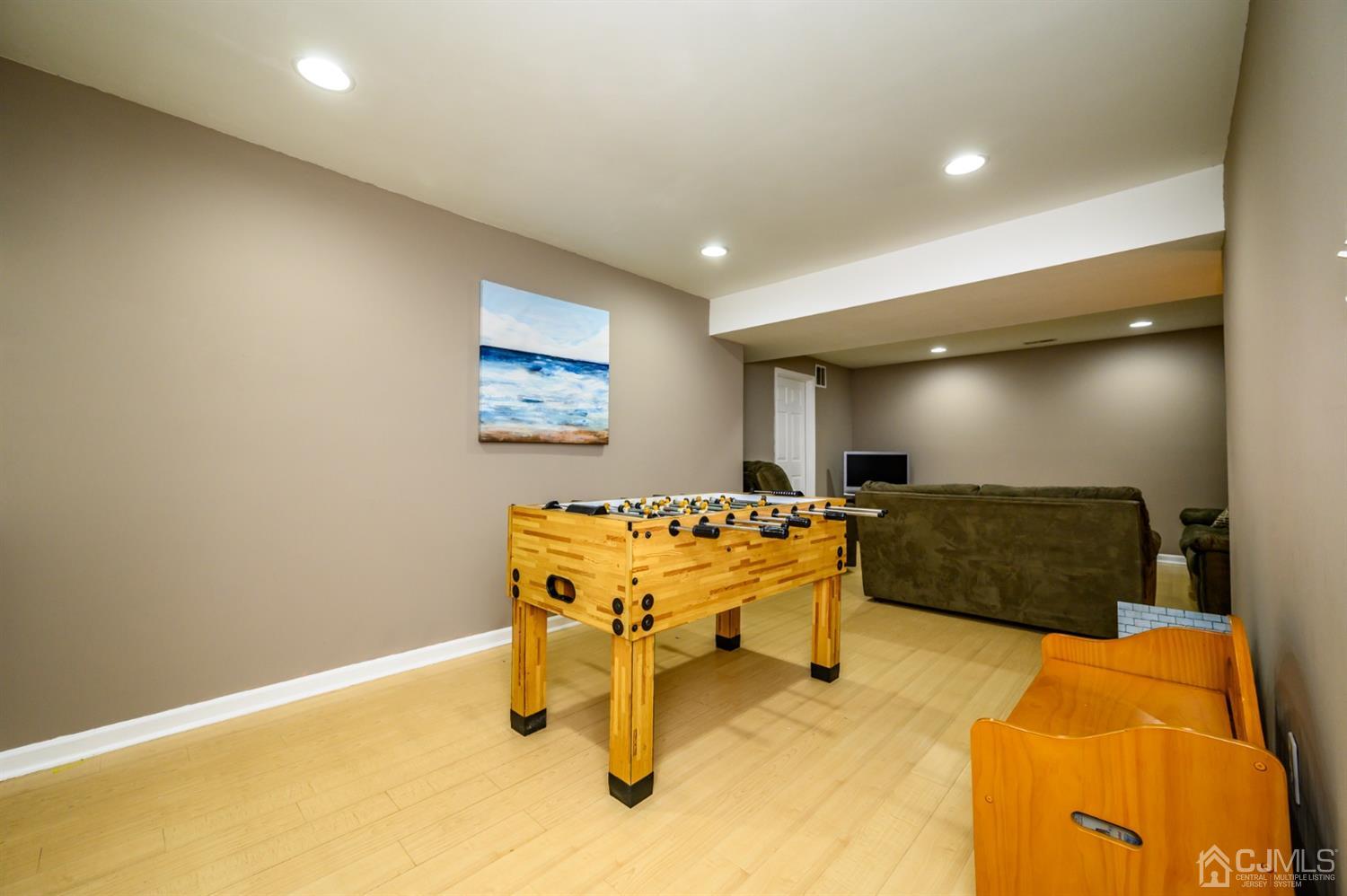 65 Lamp Post Drive Barnegat, NJ 08005 - Photo 28 of 36 a living room with furniture and a flat screen tv