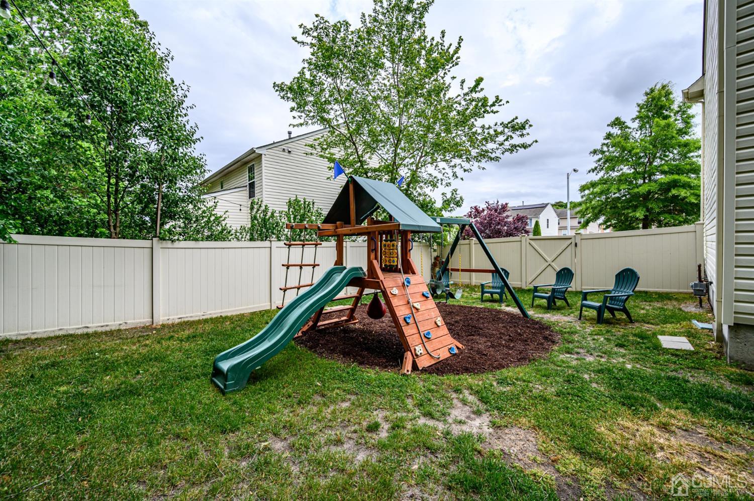 65 Lamp Post Drive Barnegat, NJ 08005 - Photo 35 of 36 a view of backyard with a slide and a slide